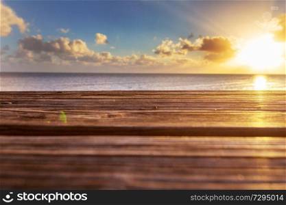 Wooden table with beach background. Travel background.