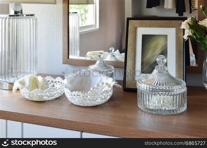 wooden table with jewelry set ,mirror,lamp in dressing room