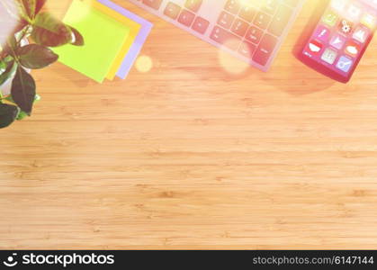 wooden table with office related objects, modern stylish work place, view from above