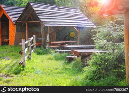 Wooden tables and benches in the gazebo at the park