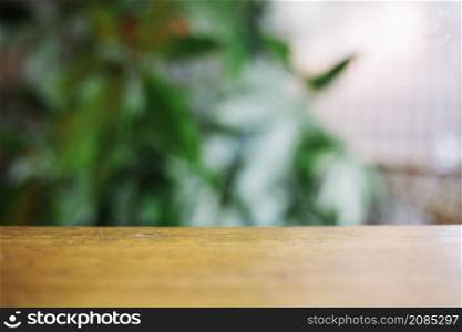 wooden tabletop blurred background plants