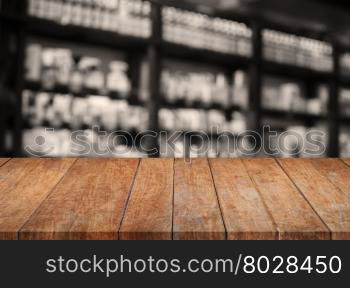 Wooden tabletop with sepia blurred background, stock photo