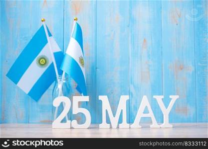 Wooden text of May 25th with Argentina flags. Argentina Revolution day and happy celebration concepts