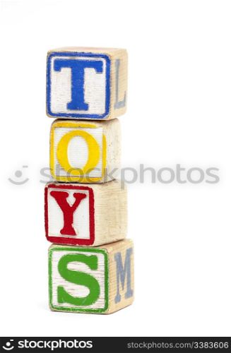 Wooden toy block stacked up to spell the word &rsquo;Toys&rsquo;