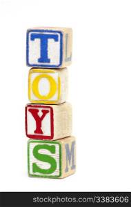 Wooden toy block stacked up to spell the word &rsquo;Toys&rsquo;