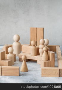 Wooden Toy Construction with ecologically wooden blocks manufactured from sustainable timbers. Wood elements for kids mental development and education. Montessori toys