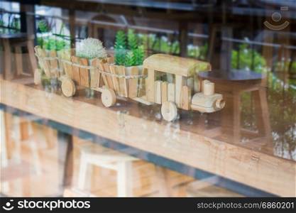Wooden toy decorated on table, stock photo
