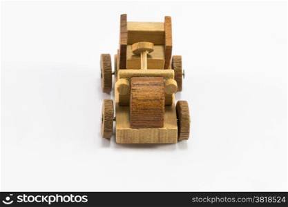 Wooden toy old car miniature isolated on white background