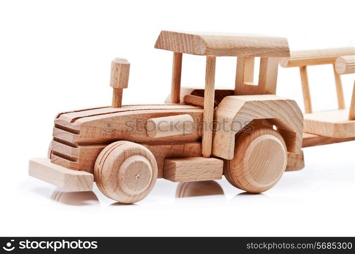 Wooden toy tractor with trailer on white isolated background&#xA;