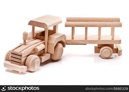 Wooden toy tractor with trailer on white isolated background&#xA;