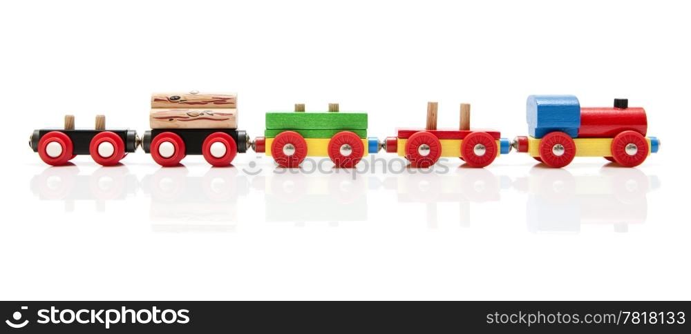 Wooden toy train with a locomotive and four carriages, half unloaded from left to right with a subtle reflection on a white background