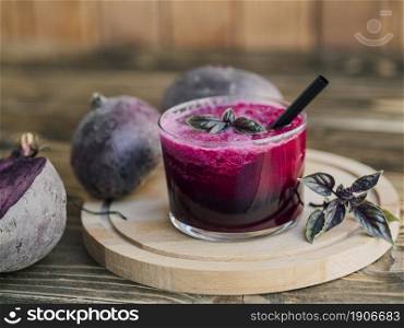 wooden tray with glass beetroot juice. High resolution photo. wooden tray with glass beetroot juice. High quality photo