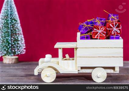 Wooden truck loaded with Christmas gifts