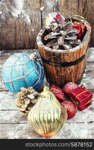 wooden tub with pine cones and Christmas decorations and ornaments