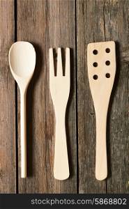 Wooden utensils on rustic background