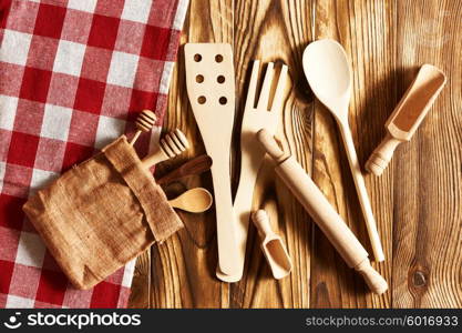 Wooden utensils on rustic background