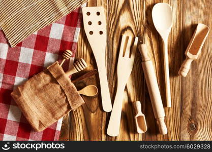 Wooden utensils on rustic background