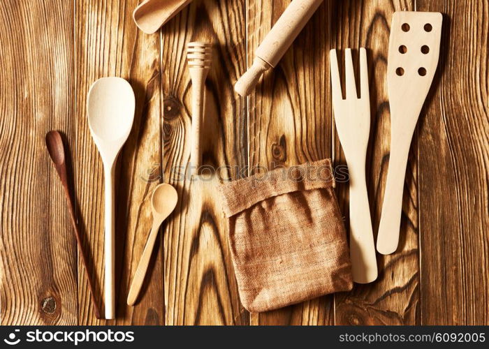 Wooden utensils on rustic background