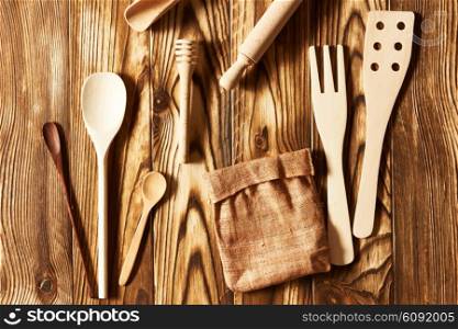 Wooden utensils on rustic background