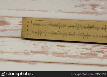 Wooden Vintage Slide Rule: Mathematical Calculator - School Education Theme.. Wooden Vintage Slide Rule: Mathematical Calculator - School Education Theme