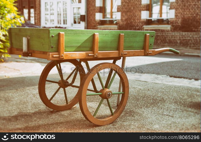 Wooden wagon next to some houses in Normandy, France