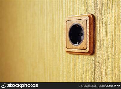 wooden wall outlet closeup photo