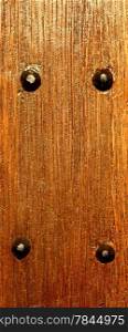 Wooden wall texture, brown wood with rivets background