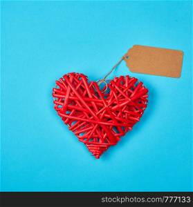 wooden wicker red heart, blue holiday background