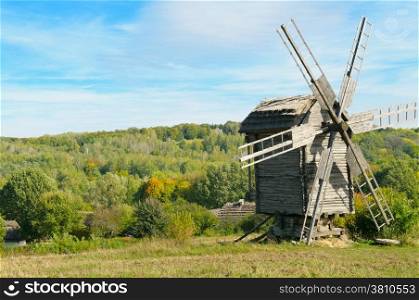 wooden windmill and a beautiful autumn landscape