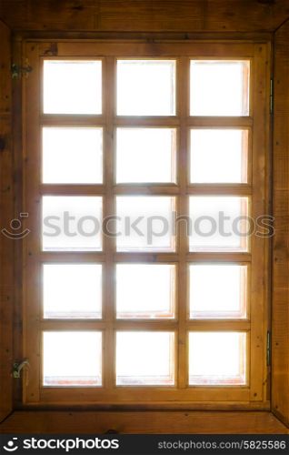 Wooden window with bars isolated on white
