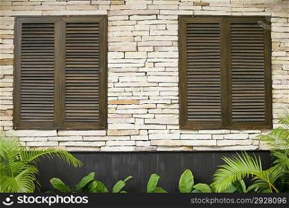 Wooden windows in brick wall