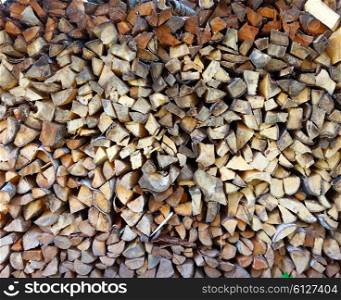 Woodpile of firewood in a garden