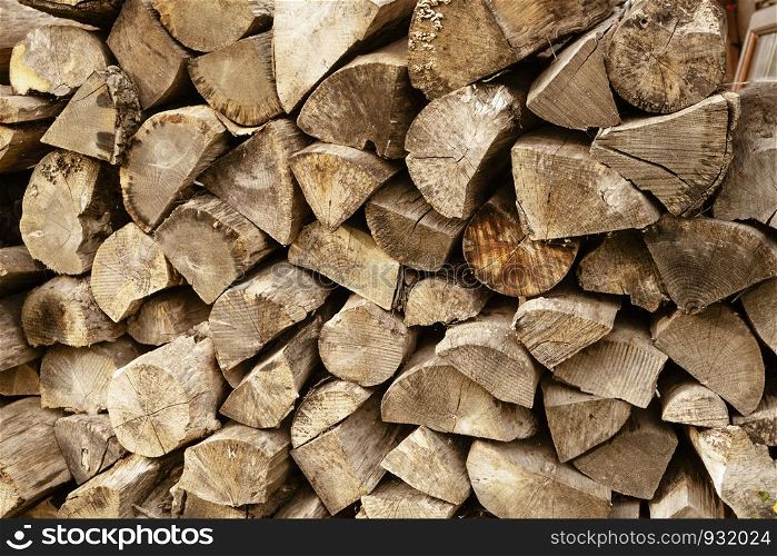 Woodpile of raw timber ready for winter season,Stack of firewoods,Pile of wood logs from forest,