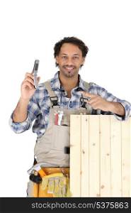 woodworker holding a cell phone