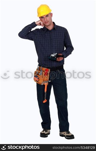 Woodworker holding a sander