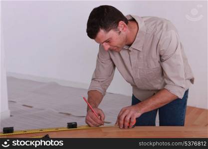 woodworker taking measurements