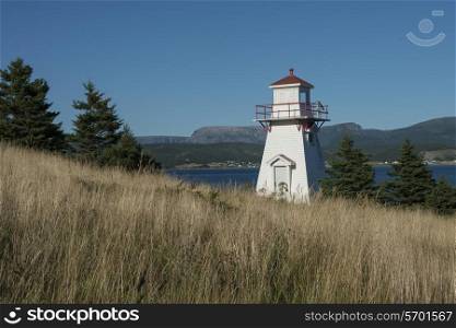 Woody Point Lighthouse at coast, Southeast Brook Falls, Gros Morne National Park, Newfoundland and Labrador, Canada