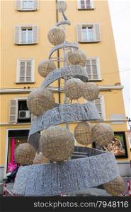 wool christmas Tree in urban street in european city