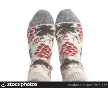 Wool socks on woman&rsquo;s feet isolated on a white background. Wool socks on woman&rsquo;s feet isolated on white background