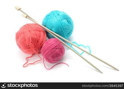 Woolen balls and knitting needles isolated on white