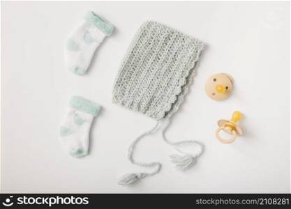 woolen headwear socks pacifiers white backdrop