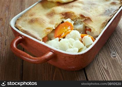 Woolton pie - dish of vegetables, widely served in Britain. cooking potatoes (or parsnips), cauliflower, swede, carrots and, possibly, turnip