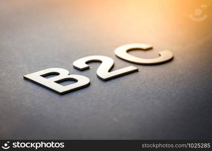 Word B2C written with white solid letters on a board. Word B2C written with white solid letters