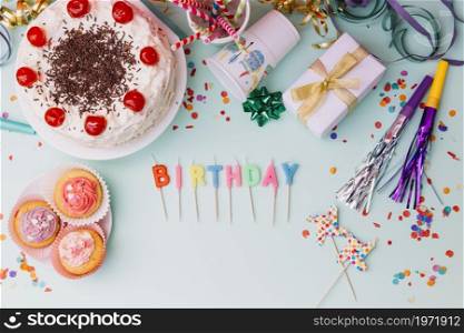 word birthday candles party accessories cake blue backdrop. High resolution photo. word birthday candles party accessories cake blue backdrop. High quality photo