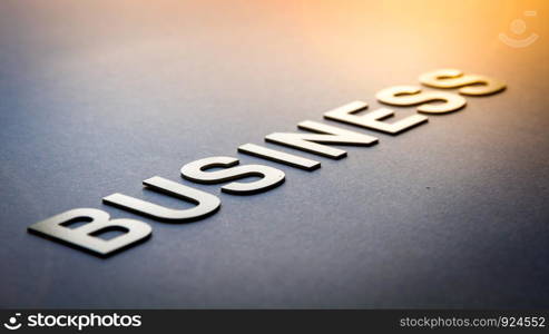 Word business written with white solid letters on a board. Word business written with white solid letters