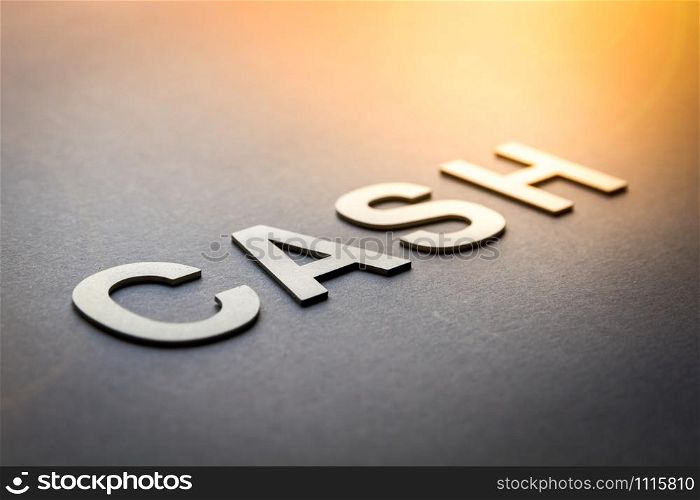Word cash written with white solid letters on a board. Word cash written with white solid letters