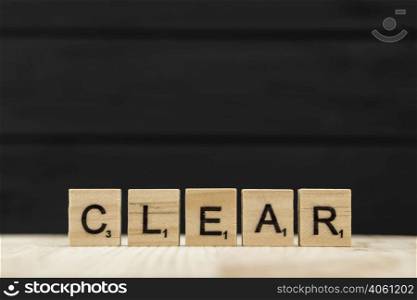 word clear spelt with wooden letters