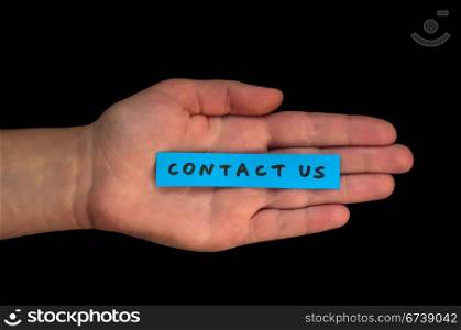 Word Contact us on blue paper and hand