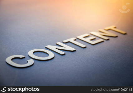 Word content written with white solid letters on a board. Word content written with white solid letters