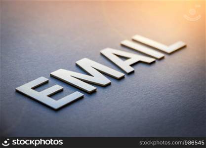 Word email written with white solid letters on a board. Word email written with white solid letters